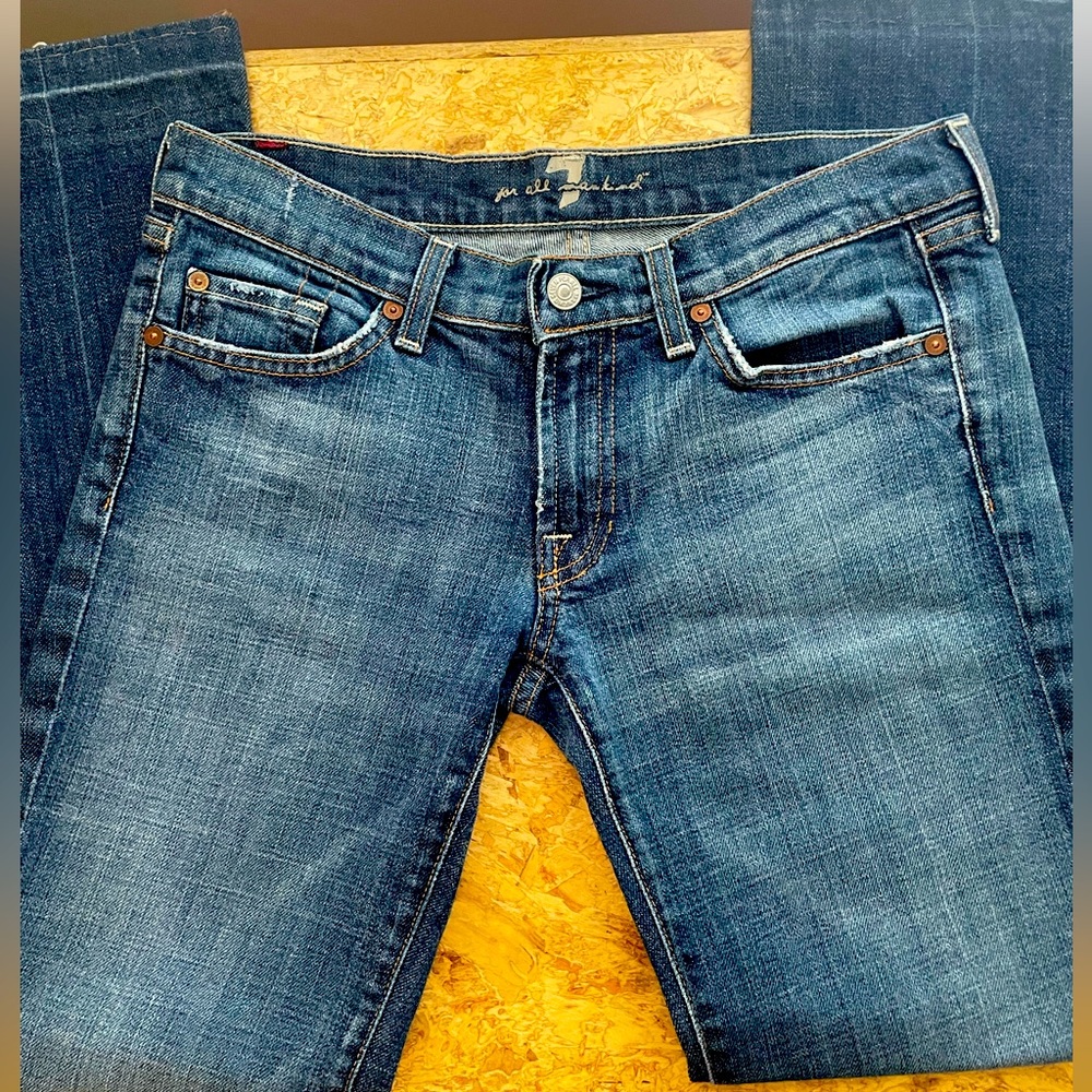 Women’s seven jeans, with pink crystal pockets.